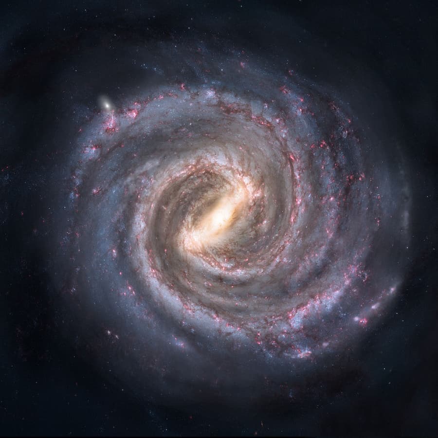 A brightly colored spiral galaxy against a dark backdrop.